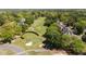 An aerial view of a golf course with lush greenery and surrounding homes at 4936 Liverpool Ln, Raleigh, NC 27604