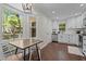 Kitchen features a breakfast nook, stainless appliances, and a view of the outdoors at 4936 Liverpool Ln, Raleigh, NC 27604