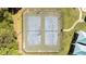 Aerial view of community tennis courts featuring fences and lampposts around the perimeter at 4936 Liverpool Ln, Raleigh, NC 27604