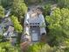 Aerial view of new construction with a pool foundation nestled in a mature community with tree-lined streets at 516 Transylvania Ave, Raleigh, NC 27609