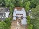 Expansive new construction featuring a brick facade, detailed roofline, and lush surrounding greenery at 516 Transylvania Ave, Raleigh, NC 27609