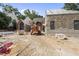 Backyard construction area features stone work and a large construction vehicle at 516 Transylvania Ave, Raleigh, NC 27609