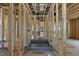 Under-construction bathroom featuring framed walls, shower base, and exposed ductwork, highlighting the initial stages of construction at 516 Transylvania Ave, Raleigh, NC 27609