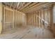 Bedroom being framed with wood, plywood, and electrical wiring ready to be developed and styled at 516 Transylvania Ave, Raleigh, NC 27609