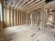 Spacious bedroom featuring wood framing, plywood subfloors and an open ceiling, during the construction phase at 516 Transylvania Ave, Raleigh, NC 27609