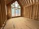 Bedroom under construction with a vaulted ceiling and a large window at 516 Transylvania Ave, Raleigh, NC 27609