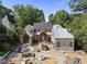 A new construction home with brick and stone accents and metal roof in a treed neighborhood at 516 Transylvania Ave, Raleigh, NC 27609