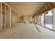 Spacious living area is ready for customization, featuring wood framing, fireplace, and sliding glass doors at 516 Transylvania Ave, Raleigh, NC 27609