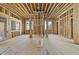 Spacious room showcases wood framing, large windows, and natural light, ready for customization at 516 Transylvania Ave, Raleigh, NC 27609