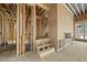 Wooden stairway is framed amid the raw wood framework, electrical, and other utilities at 516 Transylvania Ave, Raleigh, NC 27609
