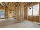 Open-concept living space with exposed wood framing, windows, and natural light ready to be customized at 516 Transylvania Ave, Raleigh, NC 27609