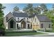 Beautiful exterior of a multi-story home with stone accents and manicured landscaping at 516 Transylvania Ave, Raleigh, NC 27609