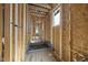 Hallway construction showcasing the plumbing and electrical framework prior to drywall installation at 516 Transylvania Ave, Raleigh, NC 27609