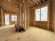 Interior view of a new home construction, featuring wooden framework, window, and ladder at 516 Transylvania Ave, Raleigh, NC 27609