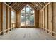 The interior is under construction with exposed framing and large windows at 516 Transylvania Ave, Raleigh, NC 27609