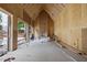 Interior of new home with fireplace area, large opening to patio and high vaulted ceiling at 516 Transylvania Ave, Raleigh, NC 27609