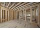 Interior view under construction featuring wood framing, various rooms, and rough plumbing, showcasing the initial stages of development at 516 Transylvania Ave, Raleigh, NC 27609