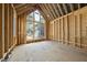 The interior is under construction with exposed framing and large windows at 516 Transylvania Ave, Raleigh, NC 27609