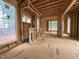 Spacious interior view showcasing the wooden framework and large windows of the new home at 516 Transylvania Ave, Raleigh, NC 27609