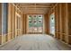 The interior is under construction with exposed framing and temporary flooring with large windows at 516 Transylvania Ave, Raleigh, NC 27609
