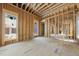 The interior is under construction with exposed framing and temporary flooring at 516 Transylvania Ave, Raleigh, NC 27609