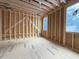 Bright interior view of new construction framing with pre-wired electrical and large windows at 516 Transylvania Ave, Raleigh, NC 27609