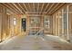The interior is under construction with exposed framing and temporary flooring in a future living space at 516 Transylvania Ave, Raleigh, NC 27609