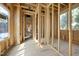 The interior is under construction with exposed framing, windows, and temporary flooring at 516 Transylvania Ave, Raleigh, NC 27609