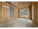 The interior is under construction with exposed framing and temporary flooring with large windows at 516 Transylvania Ave, Raleigh, NC 27609