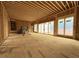 Bright living room under construction featuring a fireplace and large windows at 516 Transylvania Ave, Raleigh, NC 27609