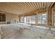 Unfinished living room showing framing with large windows and fireplace ready for customization at 516 Transylvania Ave, Raleigh, NC 27609