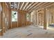 Bright, spacious room framed with numerous windows providing natural light and exposed ceiling at 516 Transylvania Ave, Raleigh, NC 27609