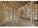 Spacious room being constructed with wood framing, electrical wiring, and exposed ceiling joists at 516 Transylvania Ave, Raleigh, NC 27609