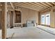 Unfinished living room showcasing framed fireplace and ample space ready for customized design at 516 Transylvania Ave, Raleigh, NC 27609