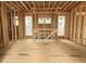 Living room under construction featuring large windows and visible framing at 516 Transylvania Ave, Raleigh, NC 27609