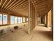 Large living room under construction, with multiple windows providing natural light at 516 Transylvania Ave, Raleigh, NC 27609