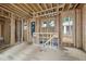 Under construction living room featuring wood framing and an abundance of natural light at 516 Transylvania Ave, Raleigh, NC 27609