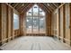 Unfinished living room with large windows and unfinished ceilings, ready for customization at 516 Transylvania Ave, Raleigh, NC 27609
