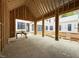 Wide-open living room featuring high ceilings with expansive windows, during the construction phase at 516 Transylvania Ave, Raleigh, NC 27609