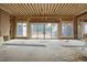 Unfinished living room showing framing with large windows and fireplace ready for customization at 516 Transylvania Ave, Raleigh, NC 27609