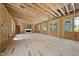 Bright living area featuring a fireplace, large windows, and wood framing offering layout potential at 516 Transylvania Ave, Raleigh, NC 27609