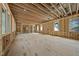 Extensive wood framing highlighting the large window openings of the space ready for customization at 516 Transylvania Ave, Raleigh, NC 27609
