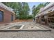 New pool under construction with brick home build, showing a large backyard and privacy at 516 Transylvania Ave, Raleigh, NC 27609