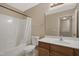 Bright bathroom with a tub/shower combo and vanity with a sink at 5329 Big Bass Dr, Raleigh, NC 27610