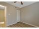 Cozy bedroom featuring a ceiling fan, wood-look floors, and a closet for storage at 5329 Big Bass Dr, Raleigh, NC 27610