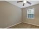 This bedroom has a ceiling fan, wood-look flooring, and a window at 5329 Big Bass Dr, Raleigh, NC 27610
