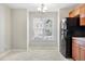 Bright eat-in kitchen area with tile floors and views of the outdoors at 5329 Big Bass Dr, Raleigh, NC 27610