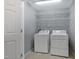Functional laundry room with shelving, washer, and dryer at 5329 Big Bass Dr, Raleigh, NC 27610