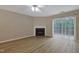 Comfortable living room featuring a fireplace and sliding glass doors to the outside at 5329 Big Bass Dr, Raleigh, NC 27610