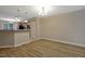 Open-concept living space with wood-look flooring, seamlessly connected to the kitchen area at 5329 Big Bass Dr, Raleigh, NC 27610